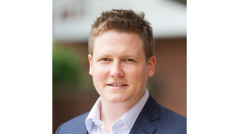 white male in a shirt and tie