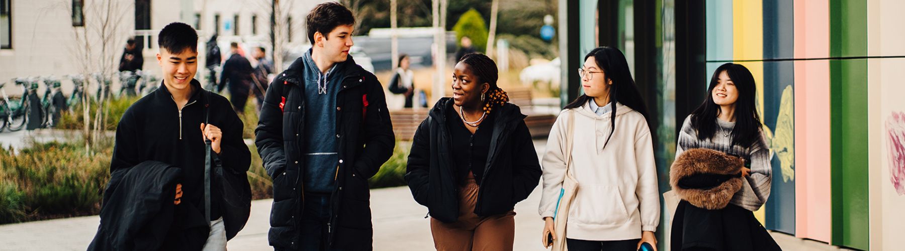 Two people each holding a book