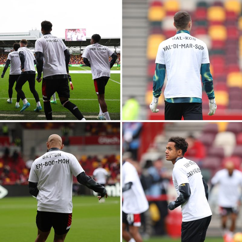 Brentford Players on the pitch with the phonetic spelling of their names on the backs of their football shirts. 