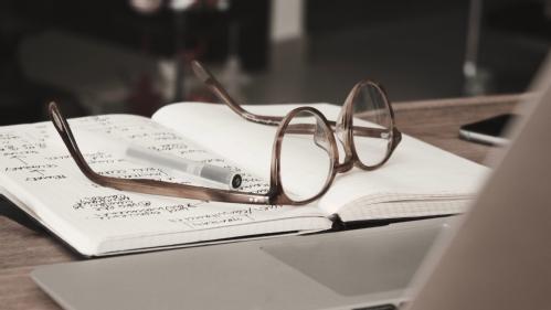 Glasses on notebook research