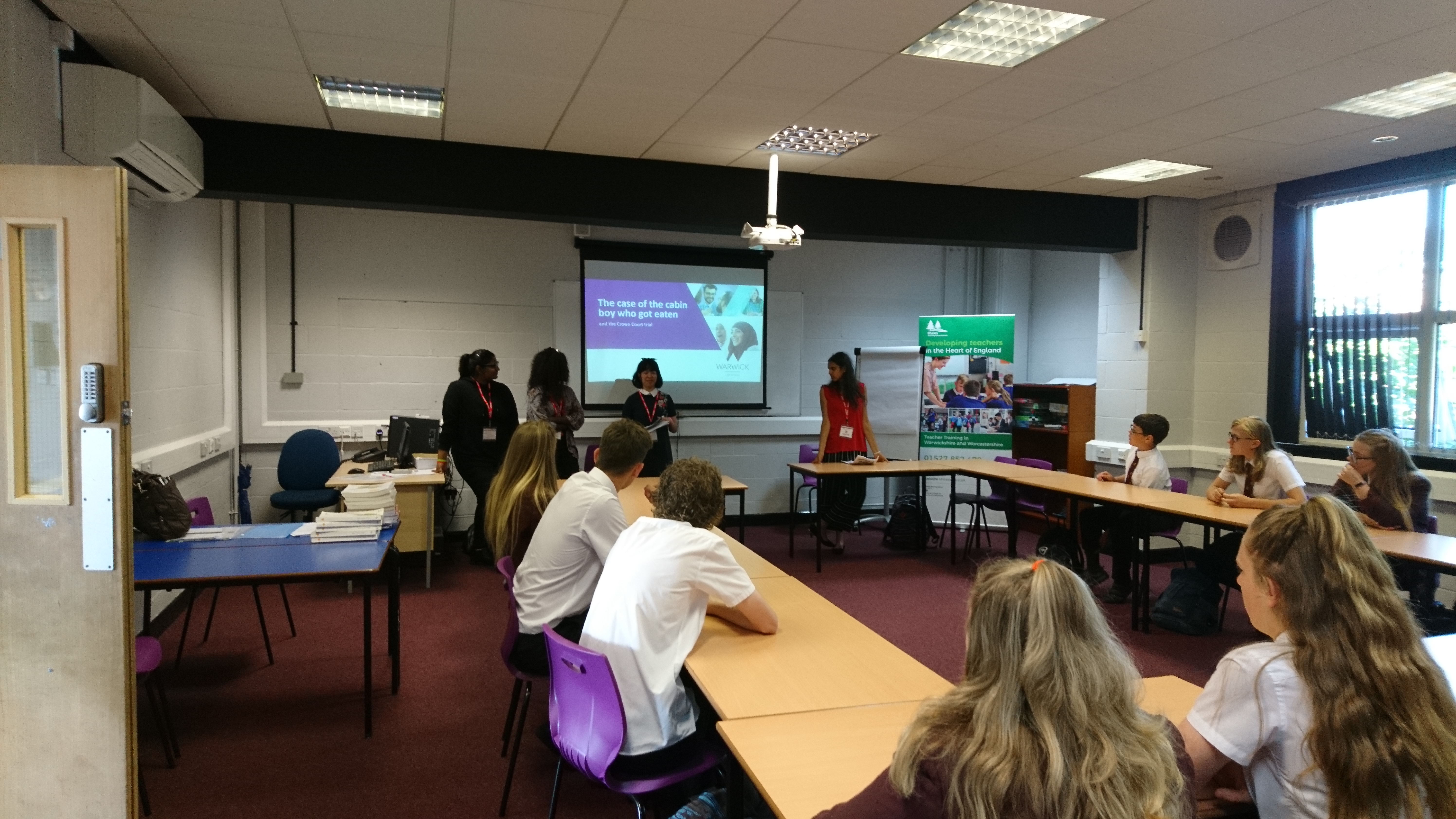 Photo of Law School student presenting a workshop to school pupils