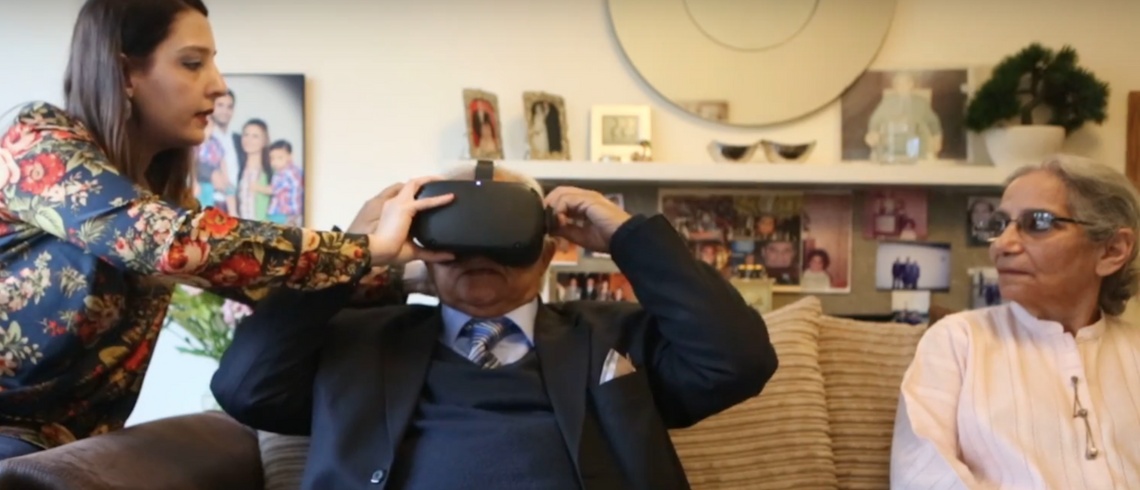 Photo of Khalid Bashir Rai using VR goggles