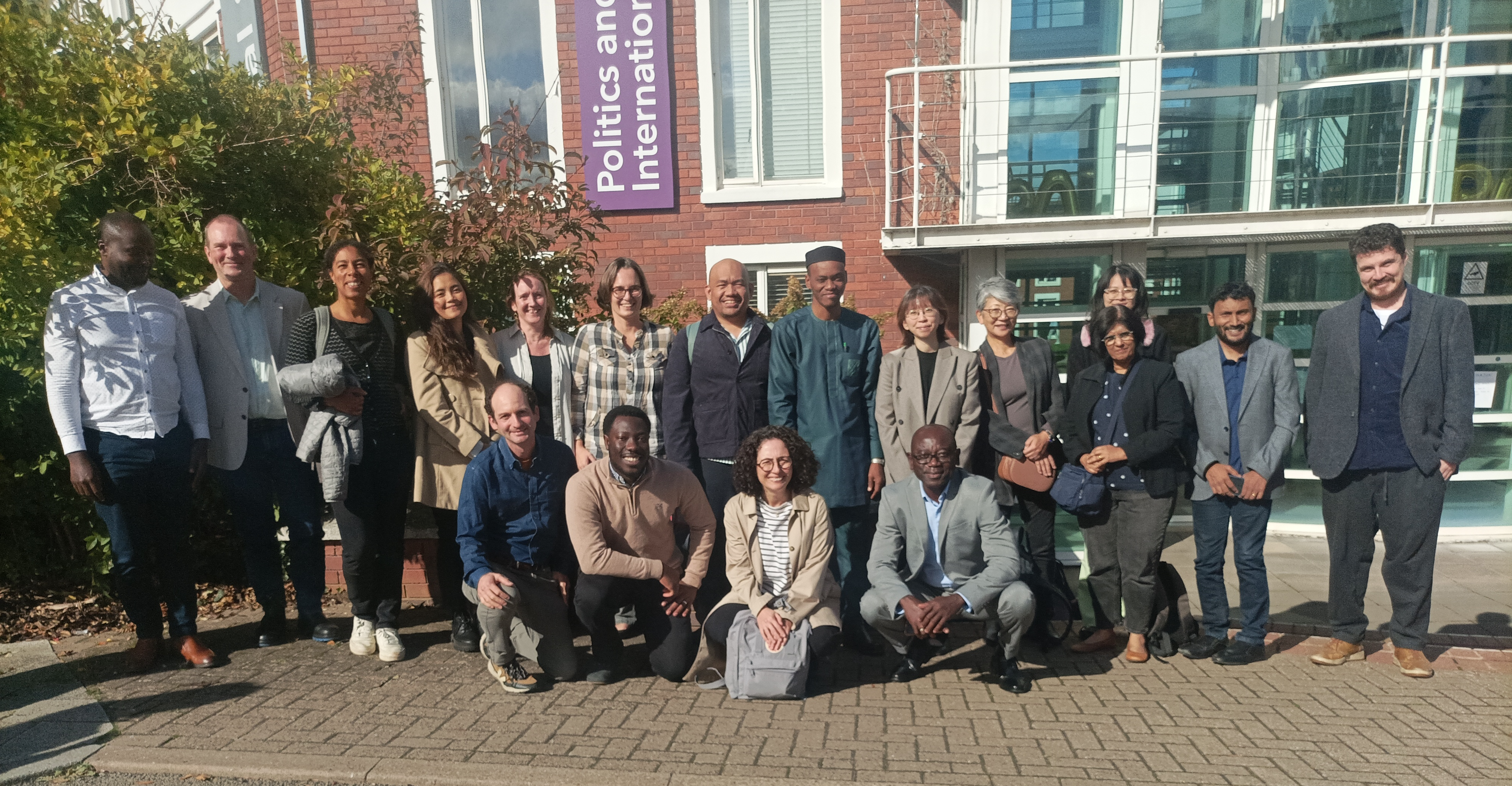 Group photo of FINDEM workshop participants outside the PAIS building