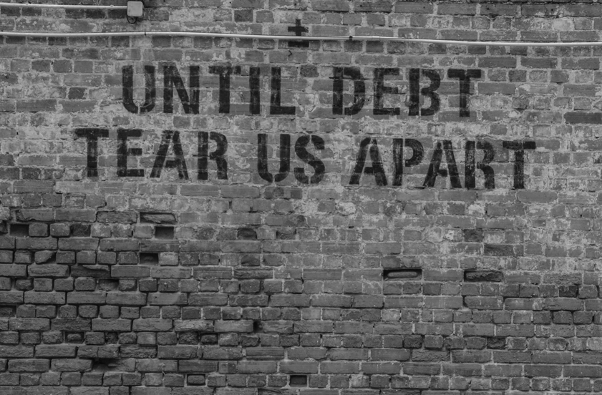 Until debt tear us apart wall sign