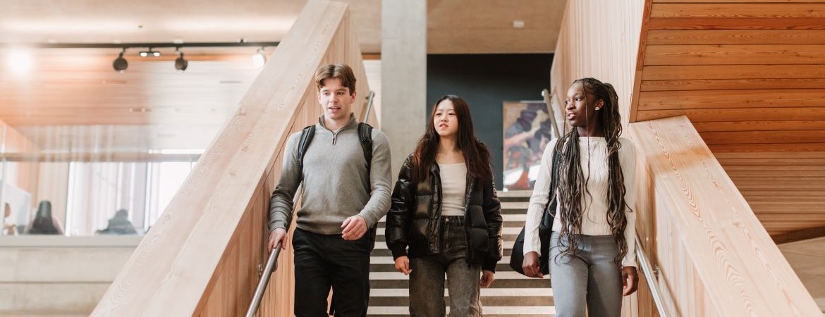 Students walking through FAB building