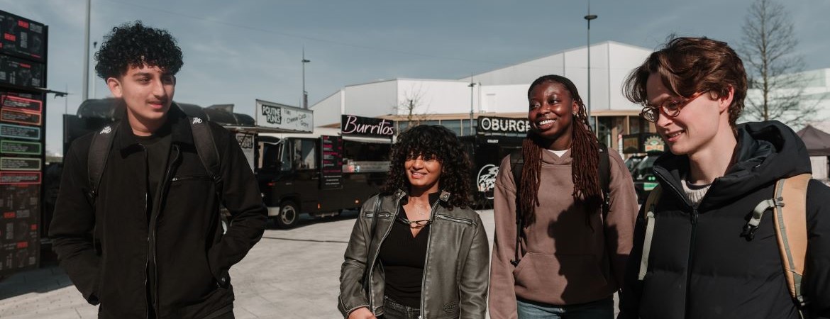 students at food market