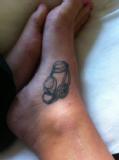 Julie Farrell: Julie chose this tattoo - a pair of goggles - to represent not only her Channel swim, but her journey through swimming from a competitive pool career cut short by ankle injuries to successful marathon swimmer.