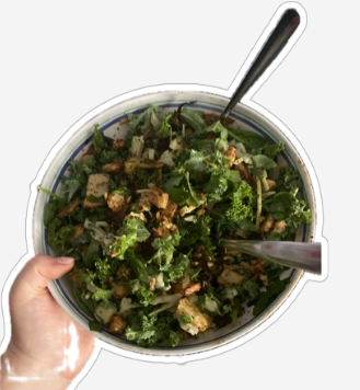 A bowl with chickpeas, broccoli, kale and potatoes