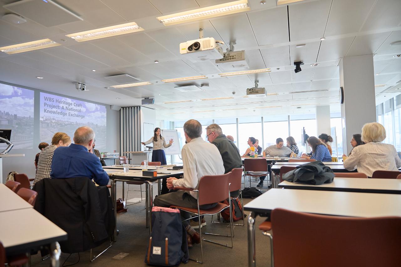 A women presenting to a room of people