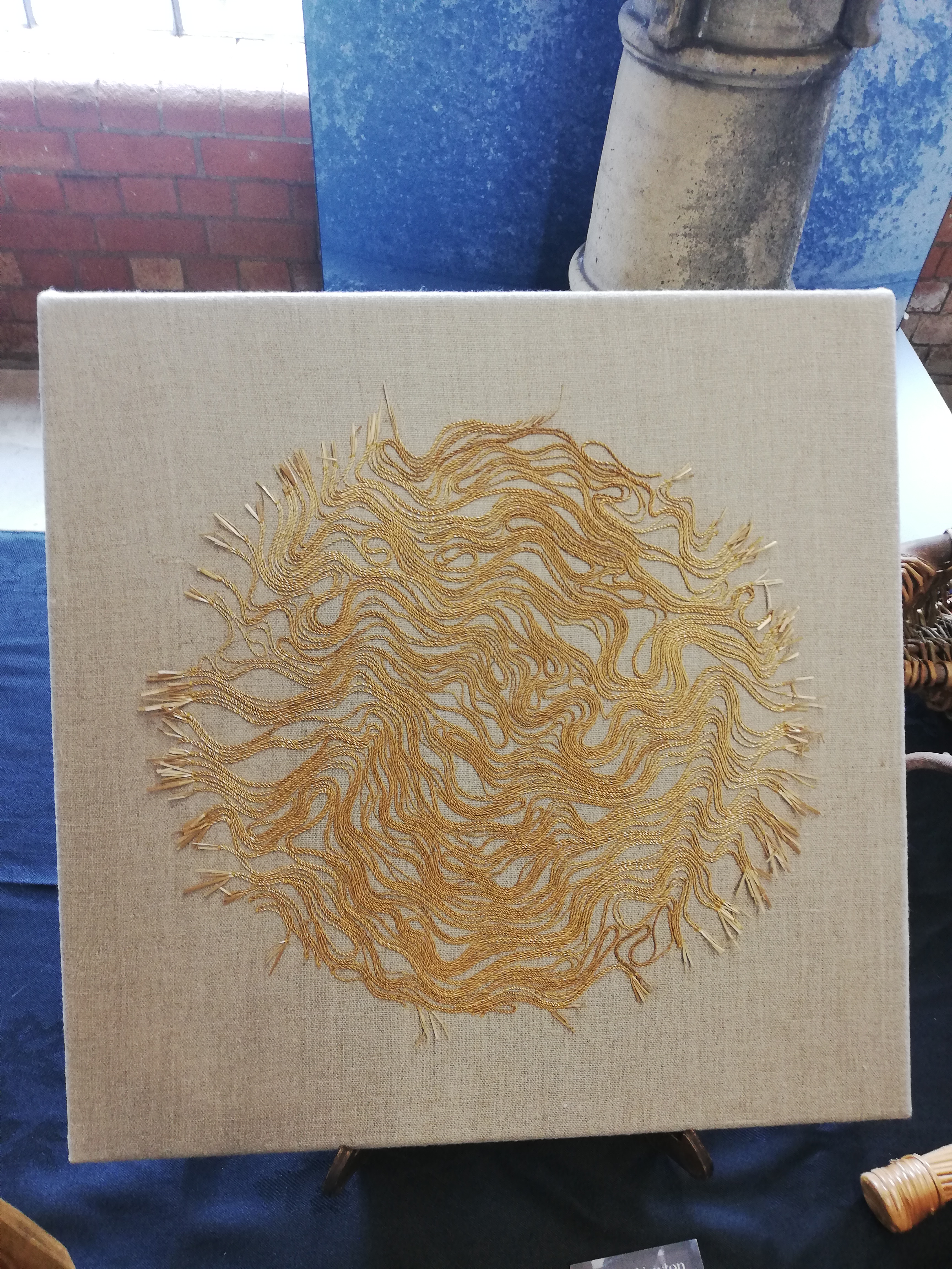 Abstract goldwork style embroidery, but done instead with straw