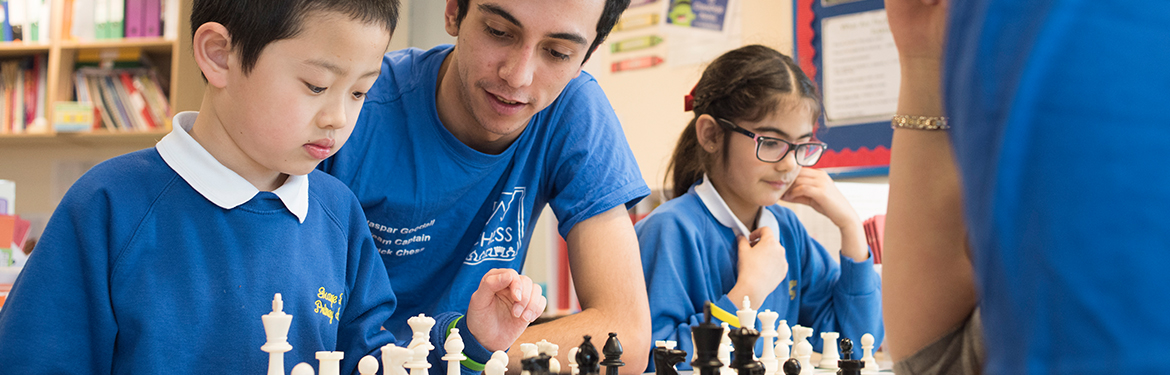 Volunteers teaching chess