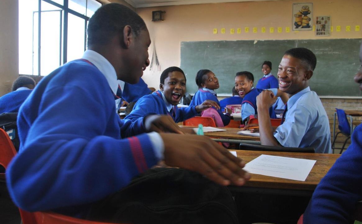 Smiling students having a conversation