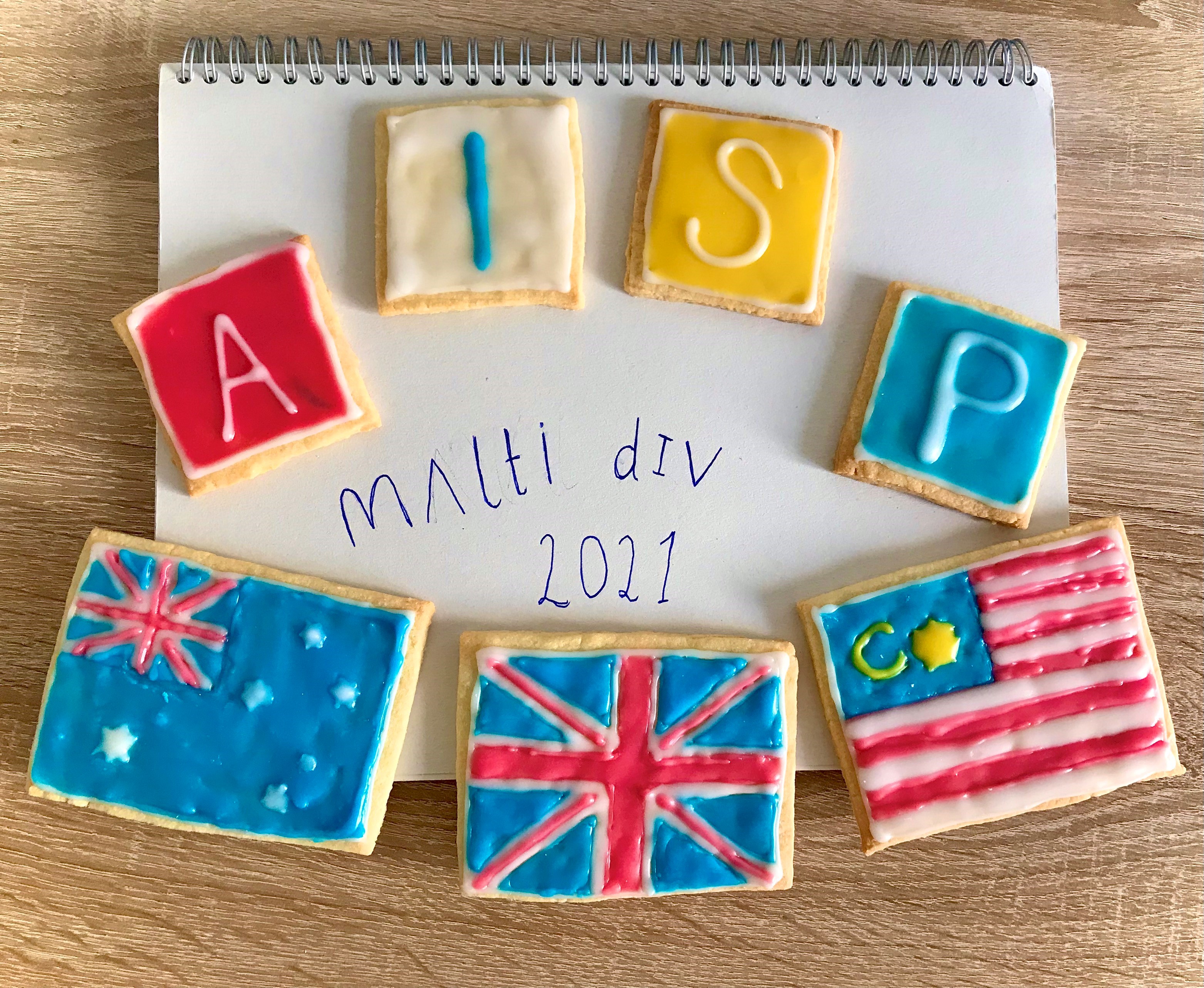 Multi Div 2021 with biscuits decorated with AISP and flags from Australia, UK and Malysia 