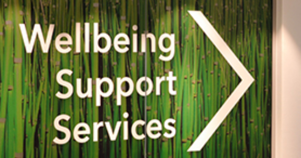 A sign indicates where to find wellbeing support services