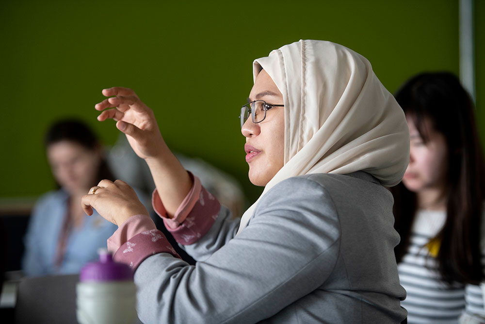 Attendees participate in debate at the Interdisciplinary Postgraduate Conference