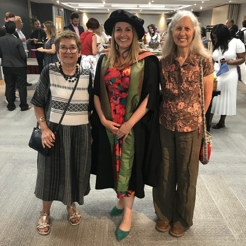 Nickie celebrating her student at her PhD ceremony.