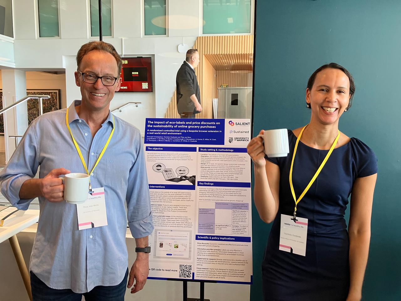 Professor Thijs van Rens (left) stood next to his poster with Professor Oyinlola Oyebode (right)