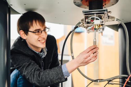 Scientist Dr Hope using an NMR machine