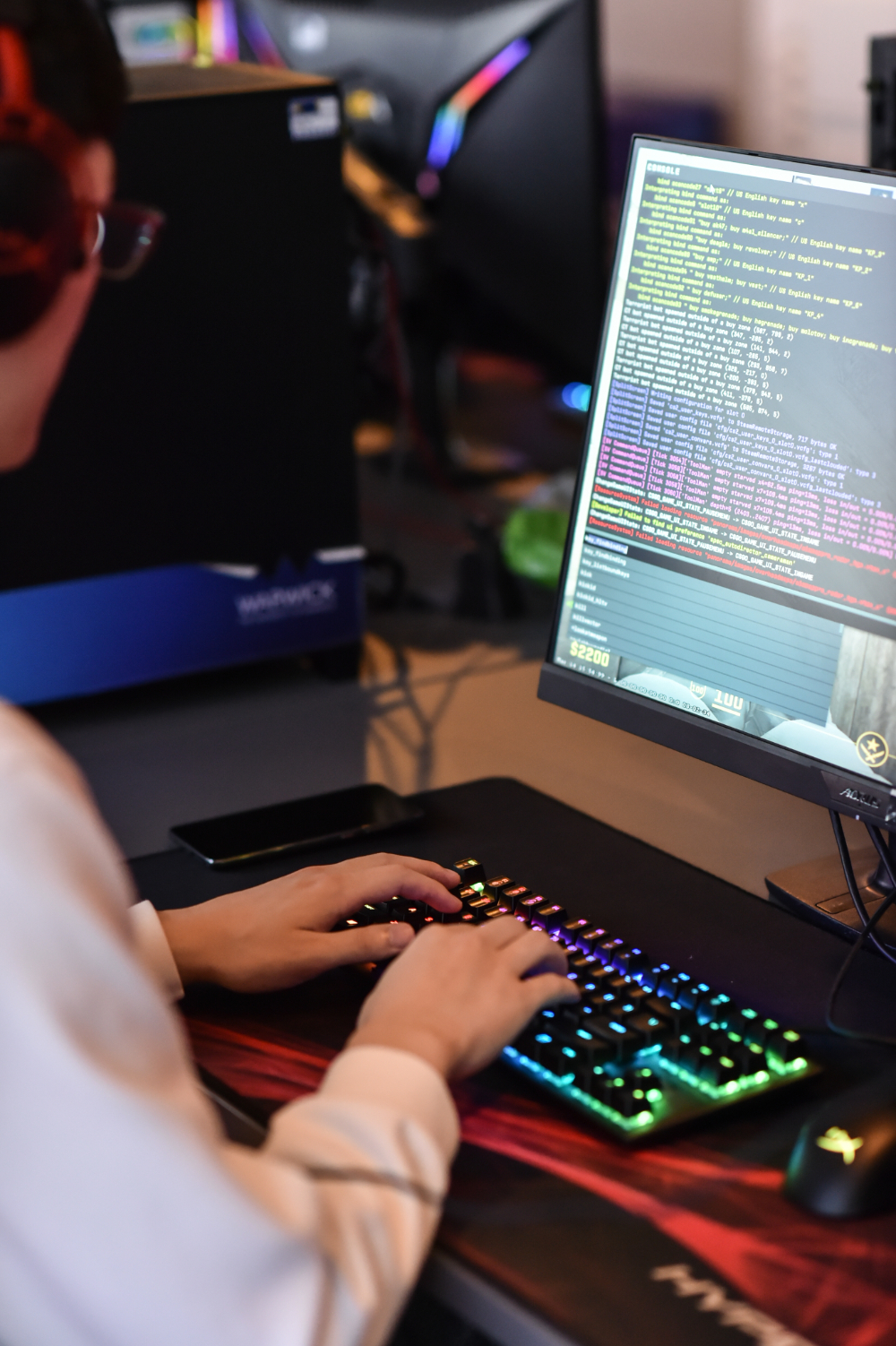 A part-seen figure prorgamming a computer