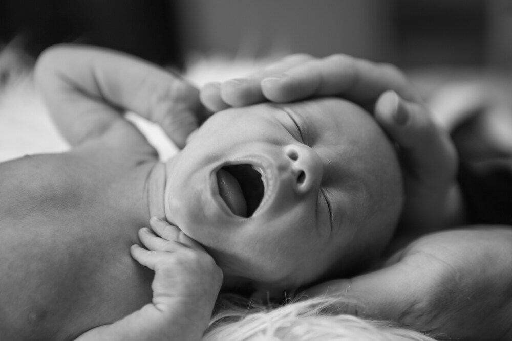 black and white image of a newborn baby