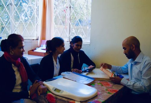 Dr Rishi Caleyachetty with healthcare workers in Mauritius