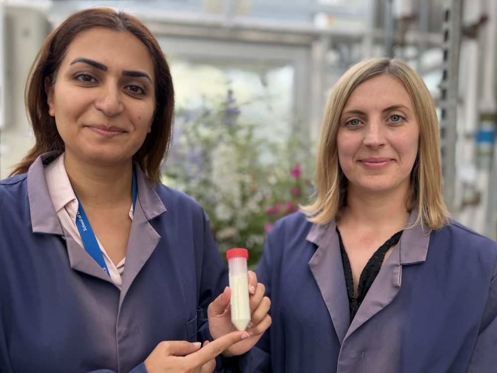 dr rabiey and dr greer holding a vial of yellow phage powder