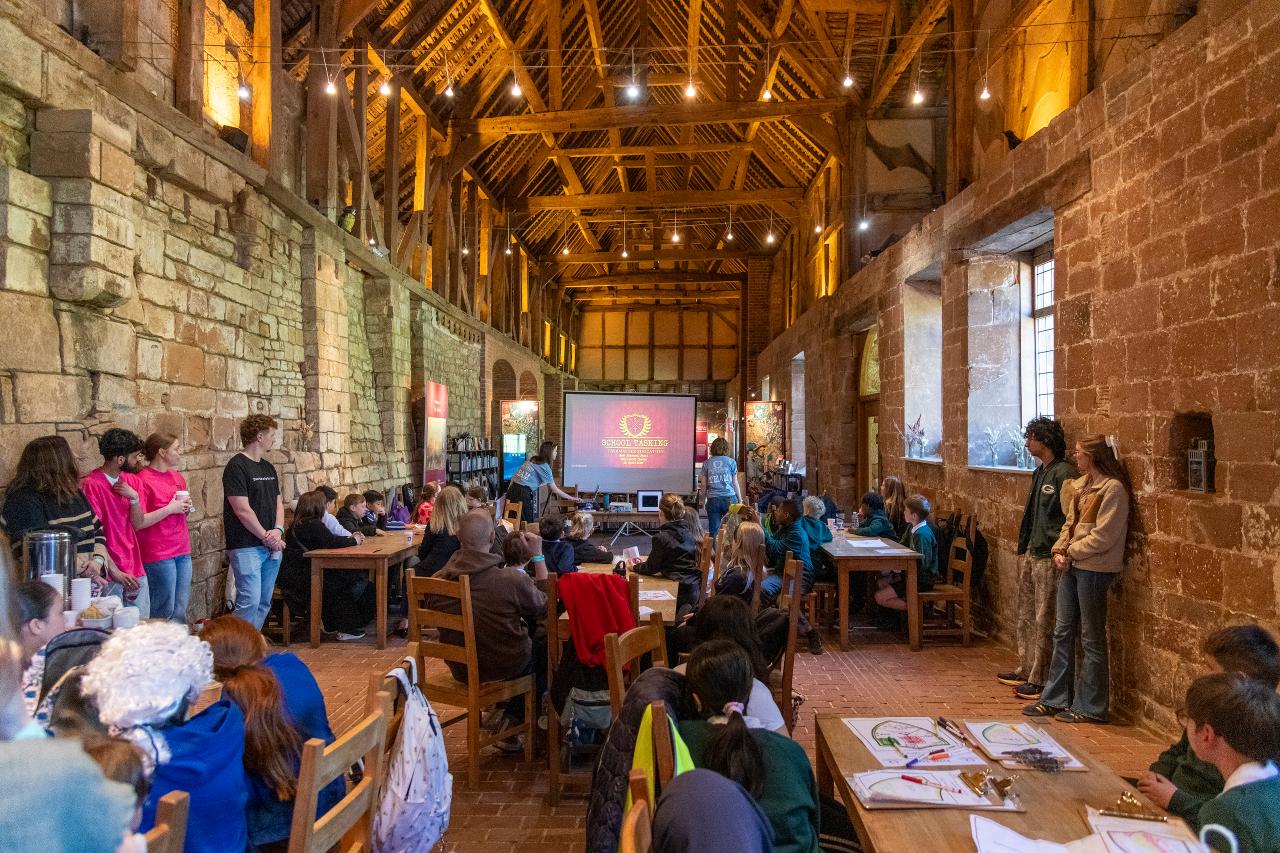 Students inside Kenilworth Castle taking part in activities