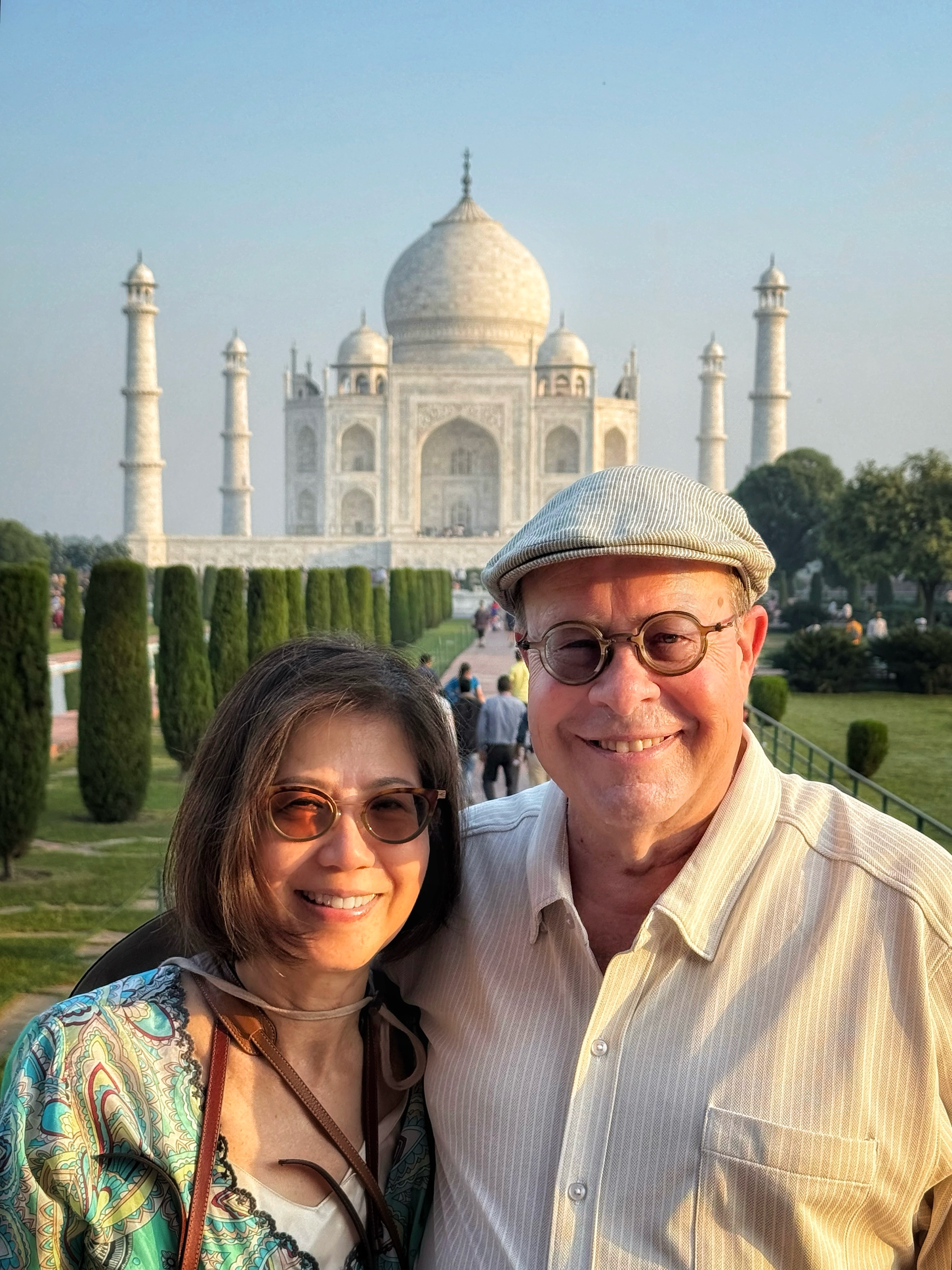 Maureen and Bill Newlin standing in front of the Taj Mahal