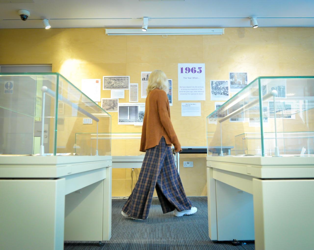 A female student walking through the Modern Records Centre