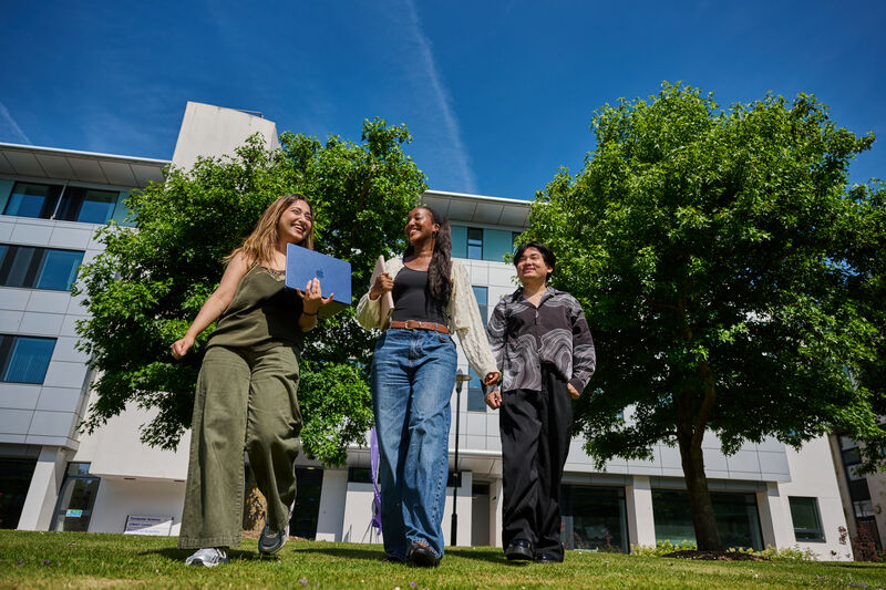 Three students outside the Computer Science building.