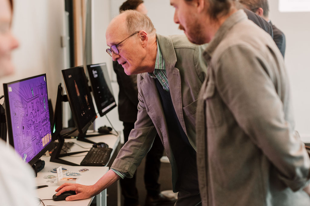 people looking at a computer screen