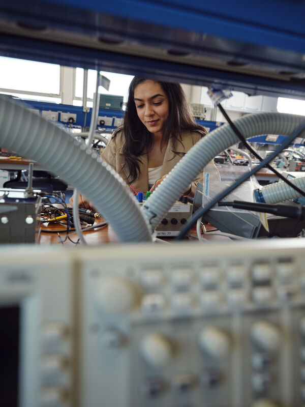 Female student working in electronics lab