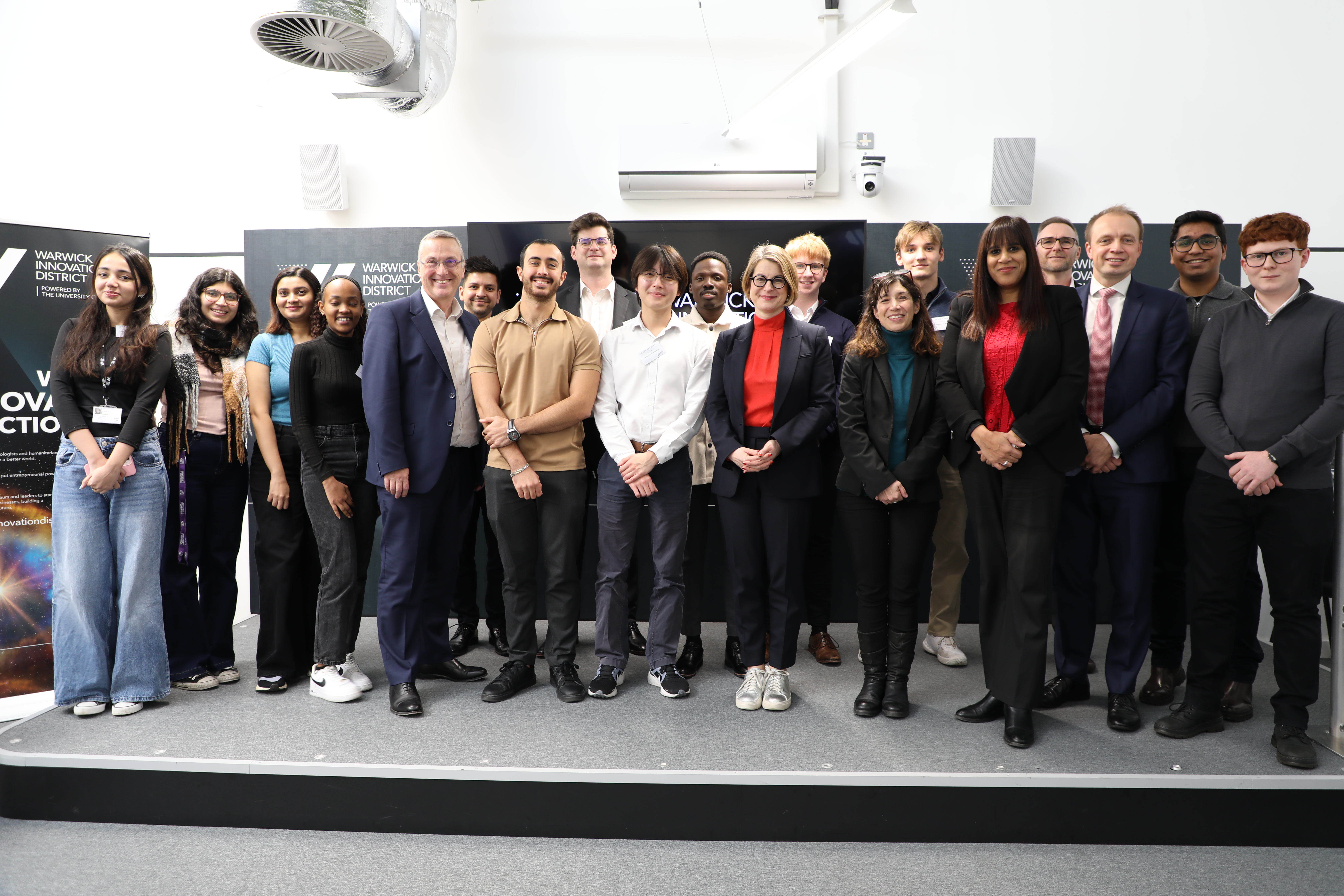 Photo of MPs, Vice-Chancellor Stuart Croft, and students