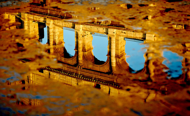 Colosseum reflected in a puddle