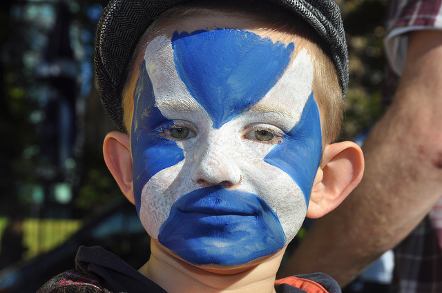 Boy with painted Scottish flag face