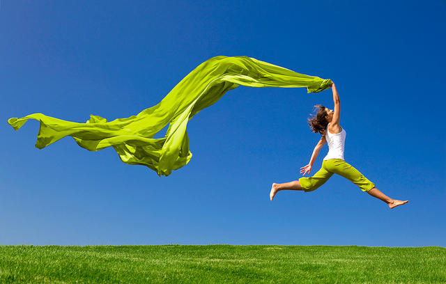 Woman jumping in a field