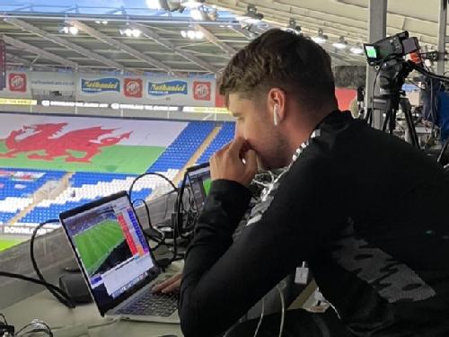 Football Association of Wales analyst prepares for a match