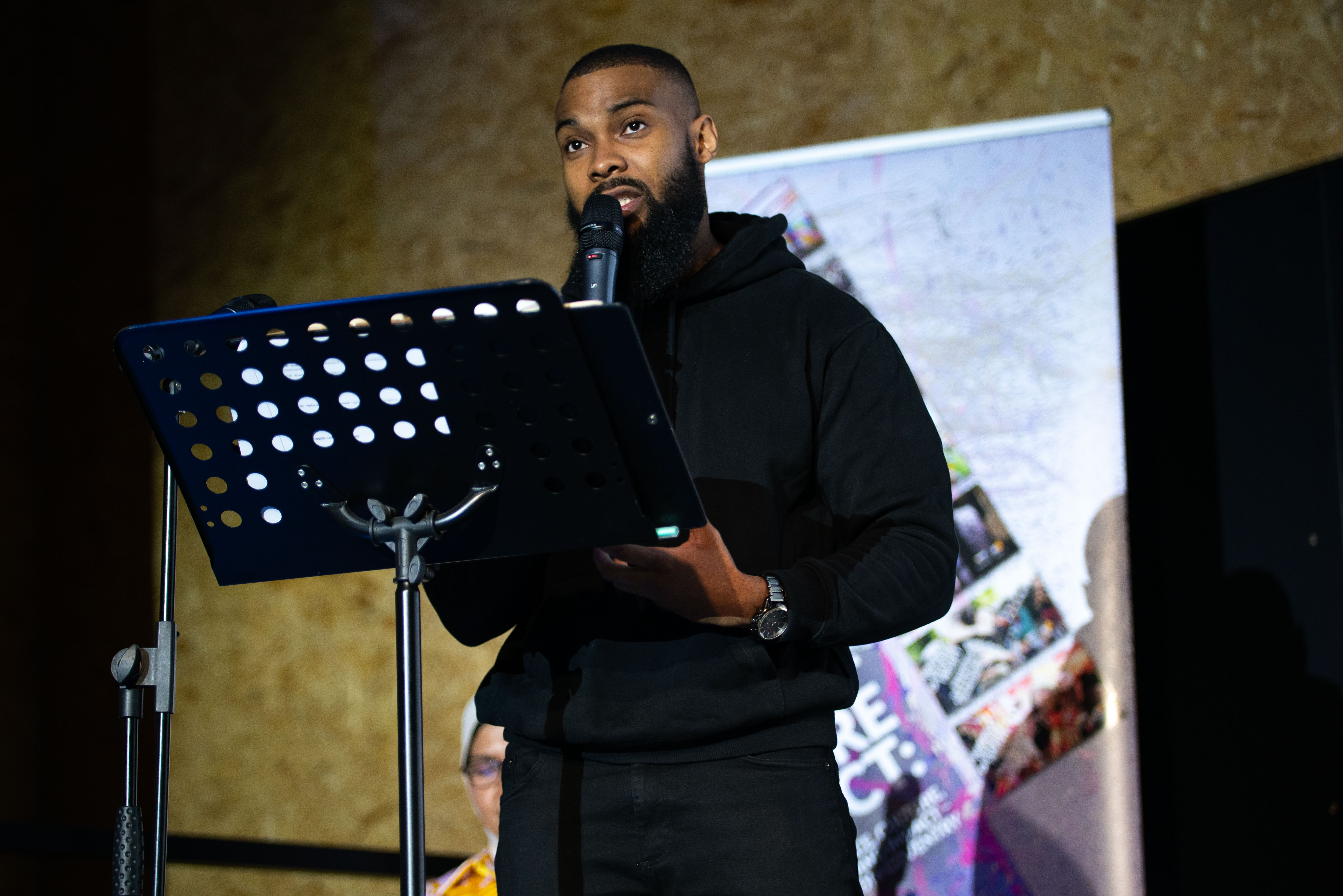 Local spoken word artist John Bernard performing at an UoW event at Fargo Village