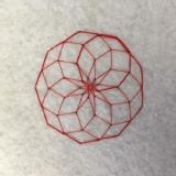 Red stitching on a white felt fabric background. There are several nonagons overlapping around a centre point to create one large nonagon with diamond shapes inside it.