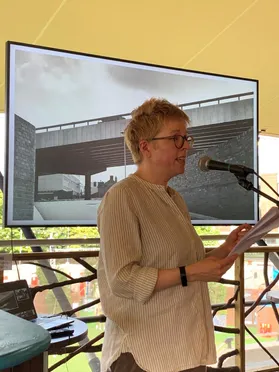 Emma Mason speaks at a poetry workshop in the Treehouse at the Assembly Festival Garden