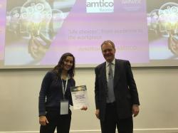 Anoushka Maini, one of the essay competition winners, receives her certificate from Jonathan Duck, CEO of Amtico International