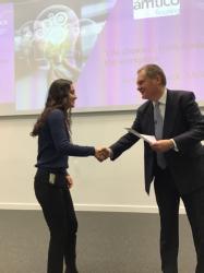 Anoushka Maini, one of the essay competition winners, receives her certificate from Jonathan Duck, CEO of Amtico International