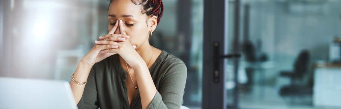 A woman looking distressed at work