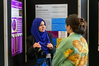 Delegates talking in the poster area of the Conference