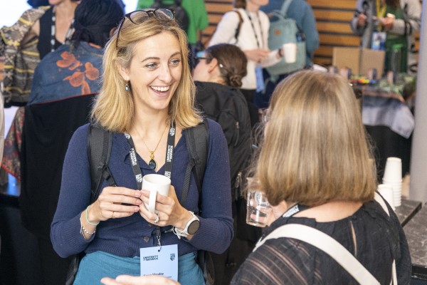 Two people talking at an event