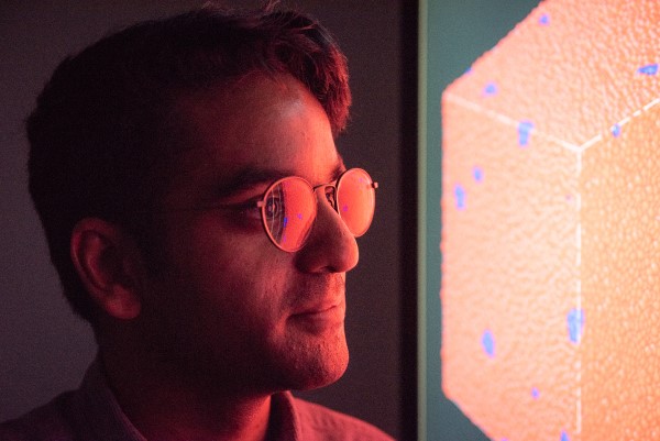 A man looking at a screen