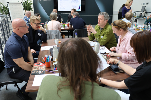 A group of Warwick academics in a meeting