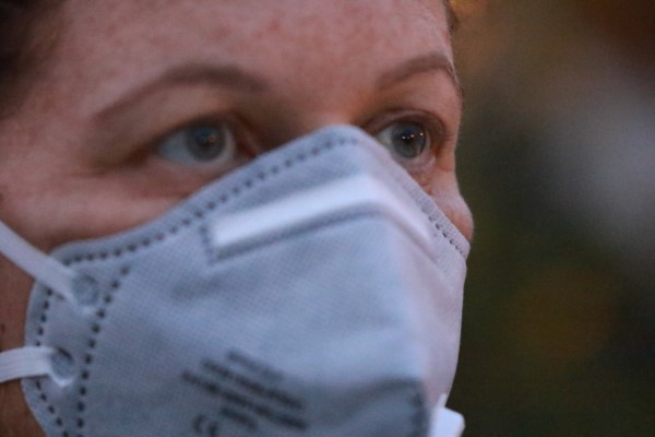 A woman in a face mask