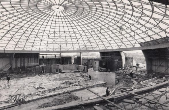 A black and white photo of oasis leisure centre construction in the 1970s