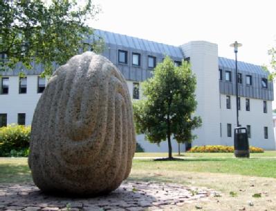 Stone sculpture behind Senate House